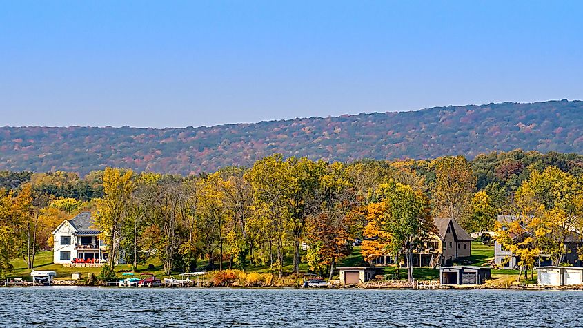 Merrimac, Wisconsin: View from a ferry hauling cars across a lake in autumn.