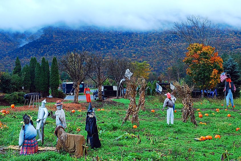 A spooky Halloween display stands under stormy skies in Manchester, Vermont, via James Kirkikis / Shutterstock.com