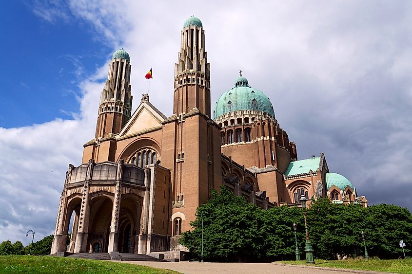 The National Basilica of the Sacred Heart, Sacre-Coeur, majestic dome, stone architecture, blue sky, Brussels, Belgium