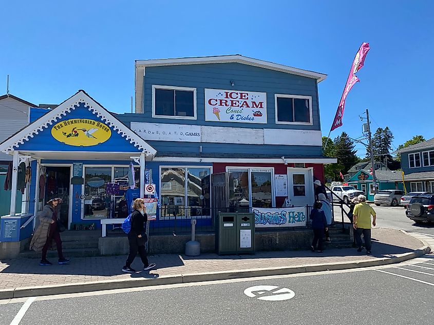 A sunny day outside of a small town ice cream shop. 