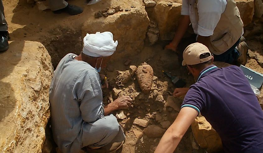 Archaeologists excavating and finding Sun Temple underneath another temple. 
