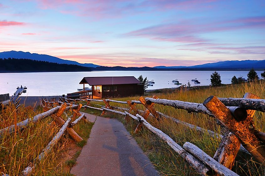 Overview of Jackson Lake with boathouse in foreground after sunset from signal Mountain campground at Grand Teton National Park, Wyoming