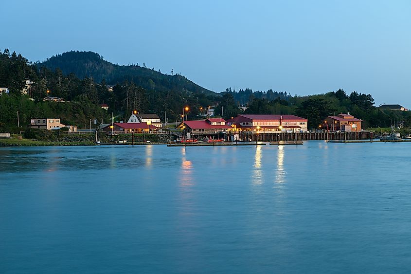 Gold Beach, Oregon, USA - April 22, 2018: The waterfront at sunset, via davidrh / Shutterstock.com