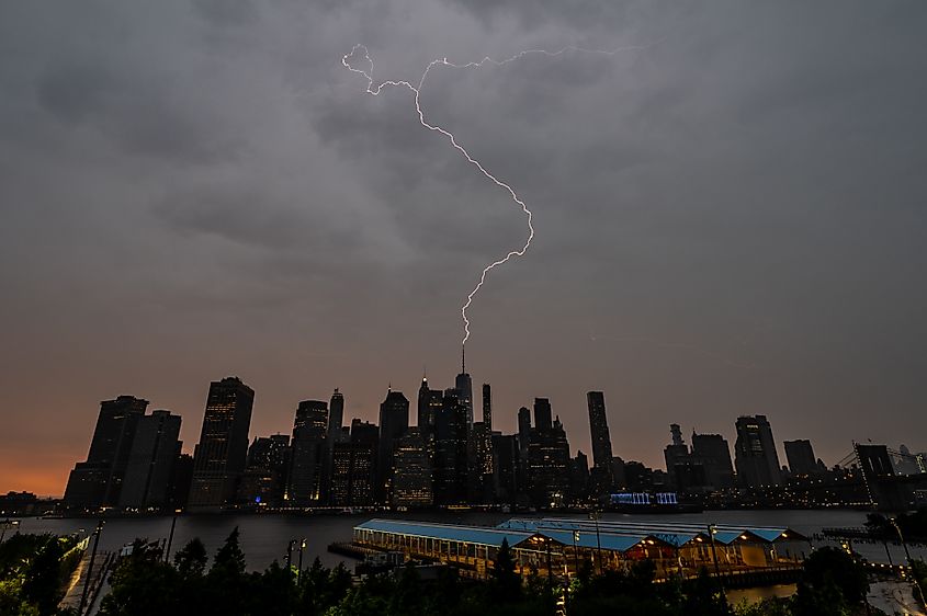 Lightning strikes the One World Trade Center as a severe-warned thunderstorm passes over the city