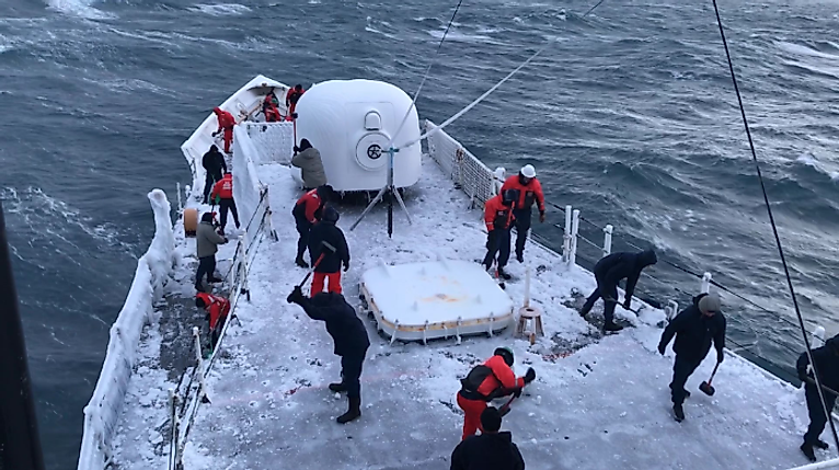 The Crew on US Coast Guard Cutter (USCGC) Mellon, breaking ice