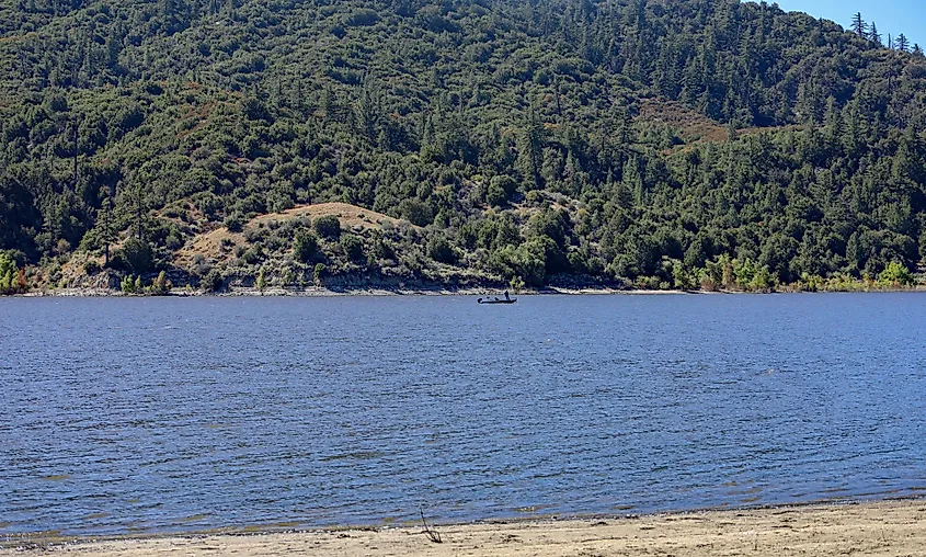 View of a person fishing in a boat at Lake Hemet in California