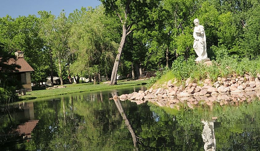 Old statue in pond Wamego, Kansas