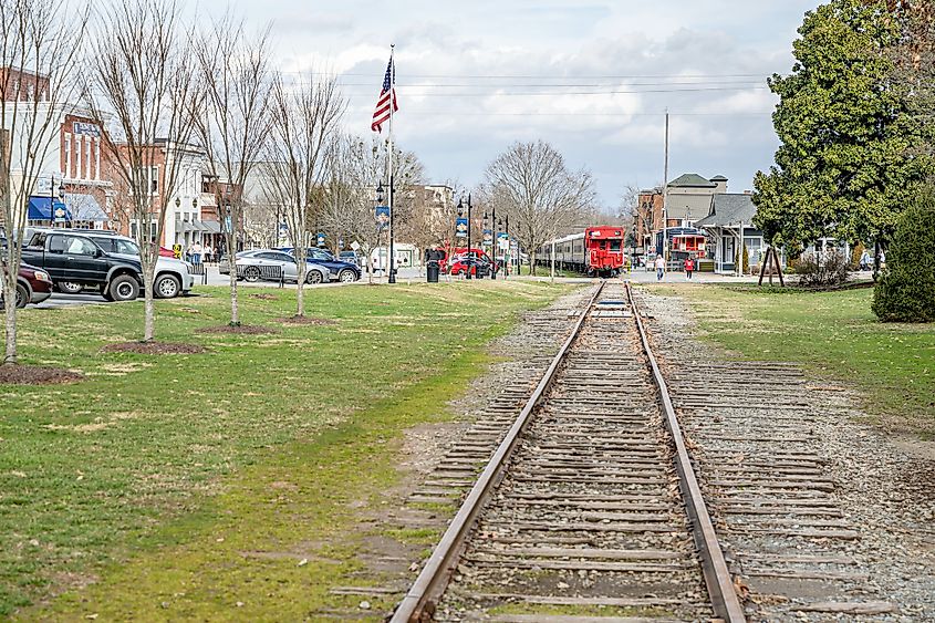 A train track with an approaching train in Blue Ridge, Georgia.