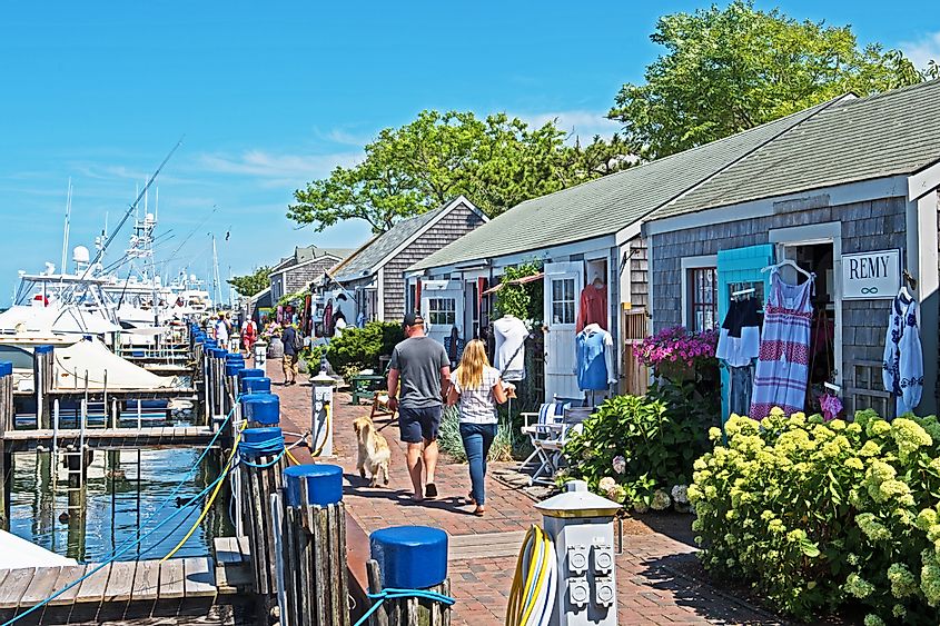 a row of eclectic stores can be found next to the harbor in Nantucket, via Mystic Stock Photography / Shutterstock.com