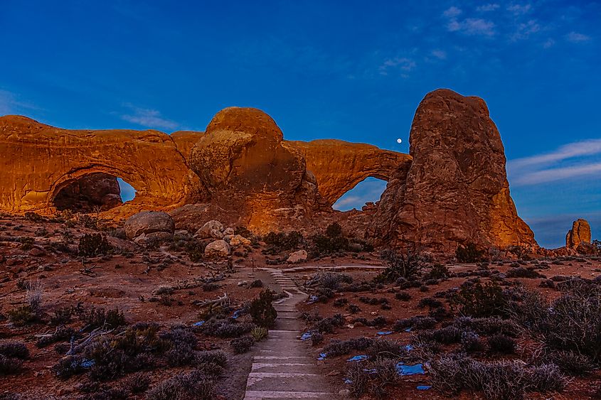 Panoramic picture of impressive sandstone formations in Arches National Park at night in winter.