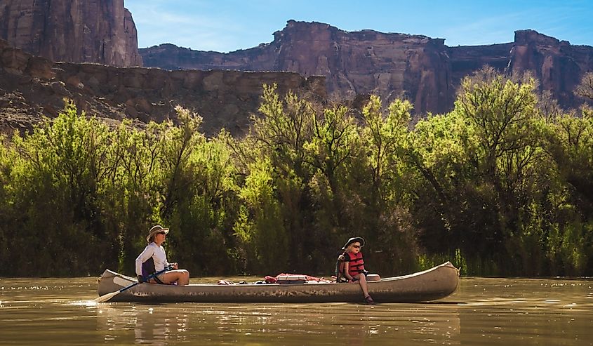 Mother and daughter paddling a canoe on Green River, Utah.