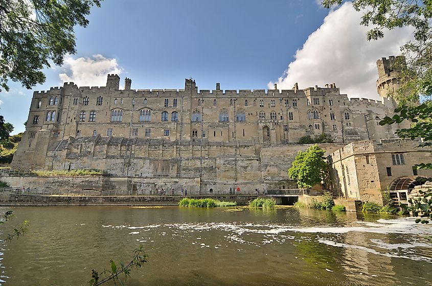 Warwick Castle situated on a meander of the River Avon, England