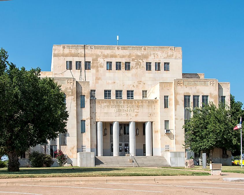 Childress County Courthouse in Childress, Texas, USA, under a clear blue sky.
