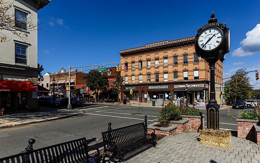 A huge clock in the main street of Madison, New Jersey downtown on a sunny afternoon, via Wirestock Creators / Shutterstock.com