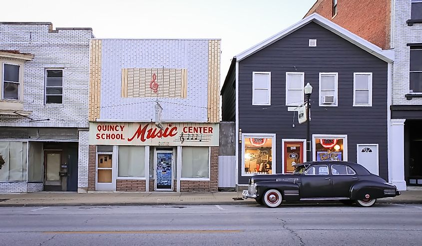 Quincy, Illinois United States - November 5 2021: a music store with a classic car parked outside