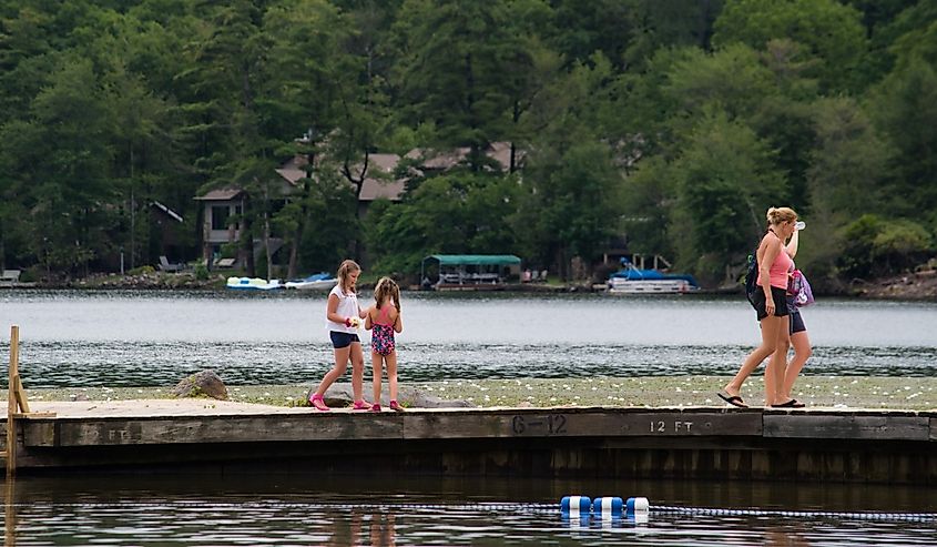 People on a dock in Lake Harmony, Pennsylvania. Image credit Alan Budman via Shutterstock