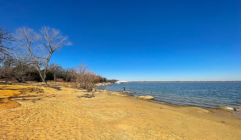 Lake Lewisville with row of fishing rods in wintertime