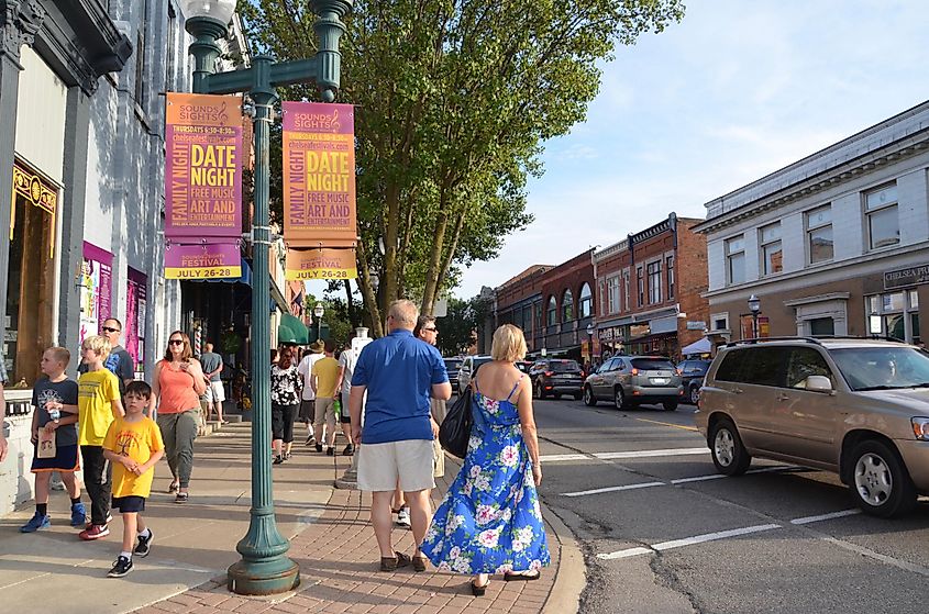 Chelsea, Michigan: Visitors walk along the streets of Chelsea at the Chelsea Sounds and Sights on Thursday Nights festival.