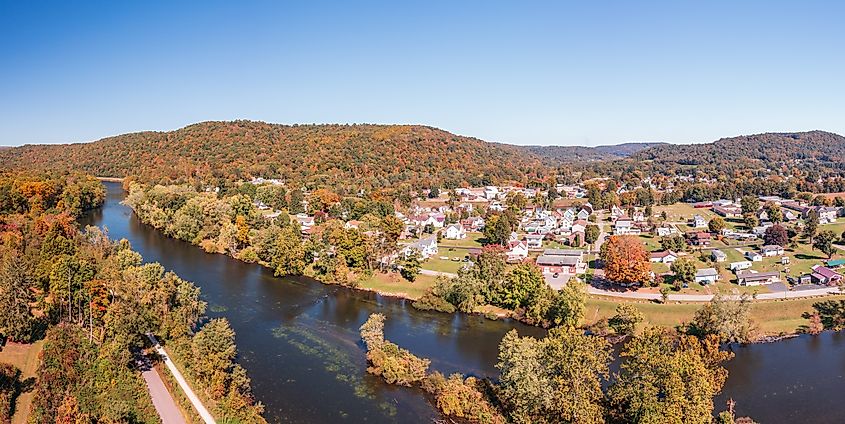 Aerial panorama of the small town of Confluence in Somerset County in Pennsylvania with fall colors on the leaves and trees.