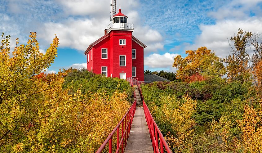 A sunny autumn day in Marquette, Michigan near its red lighthouse