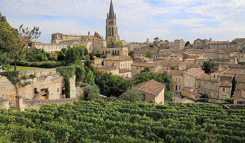 View to the medieval village of Saint-Émilion amidst the vines on a cloudy da, the most famous wine growing region near Bordeaux