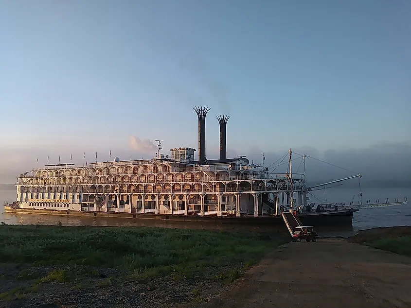 American Queen steamboat docked at a boat ramp in St. Francisville, Louisiana on September 1, 2017. Pictured in morning time with passengers onboard.