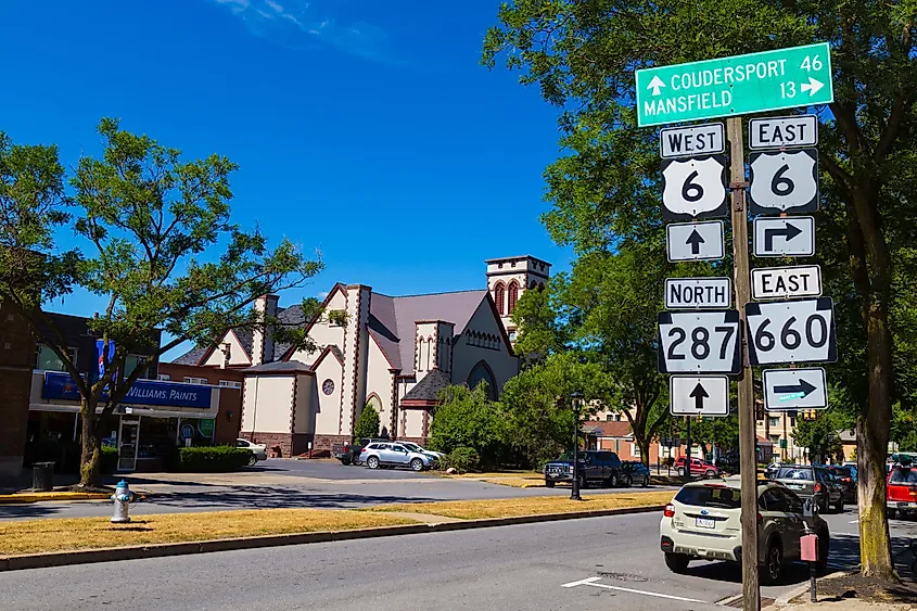 Directional route signs on Main Street in Wellsboro, Pennsylvania.