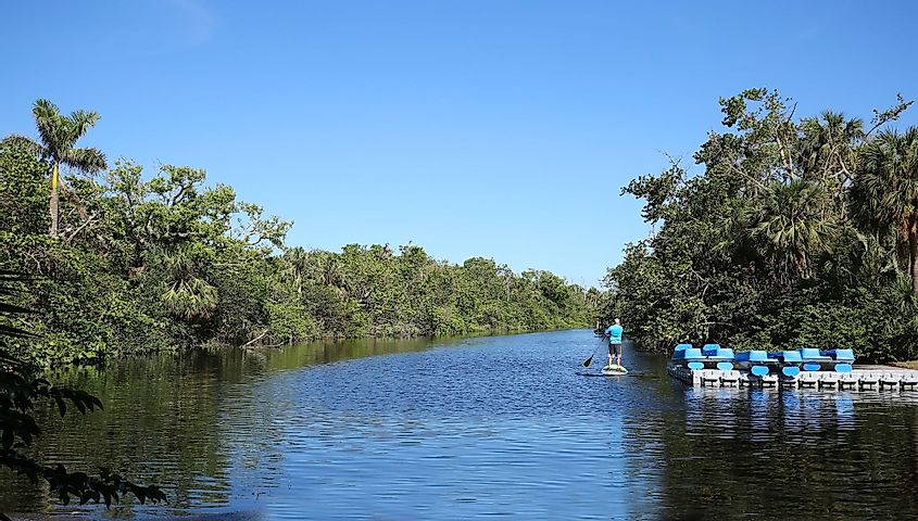 A man paddleboarding in Hugh Taylor Birch State Park, Fort Lauderdale, Florida