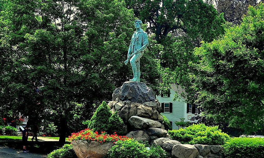 Lexington, Massachusetts- July 10, 2013: Minuteman statue of Captain John Parker on the Village Green where the Battle of Lexington ignited the American Revolution on 19 April 1775 *