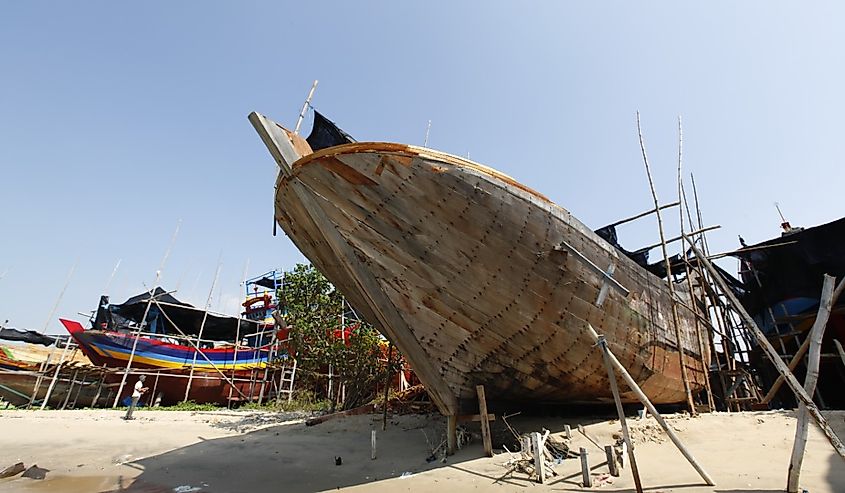 Craftsmen making fishing boats in Sarangan village, Tuban, East Java, Indonesia.