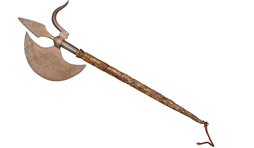 The ancient weapon - a halberd. It is isolated on a white background