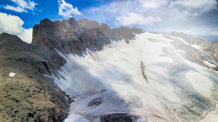 Aerial view of Marmolada Glacier from drone in summer season, Dolomite Mountains