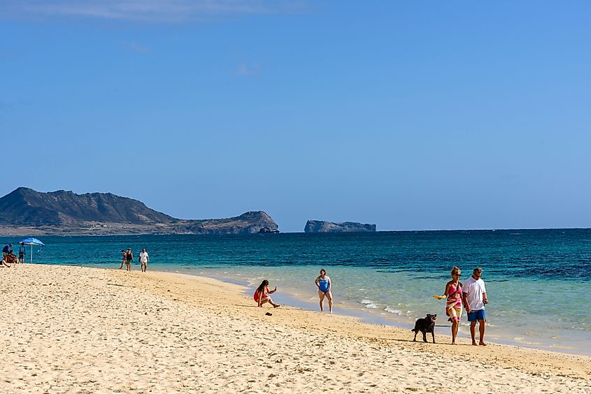 People along Lanikai Beach in the town of Kailua, Hawaii. Editorial credit: Malachi Jacobs / Shutterstock.com