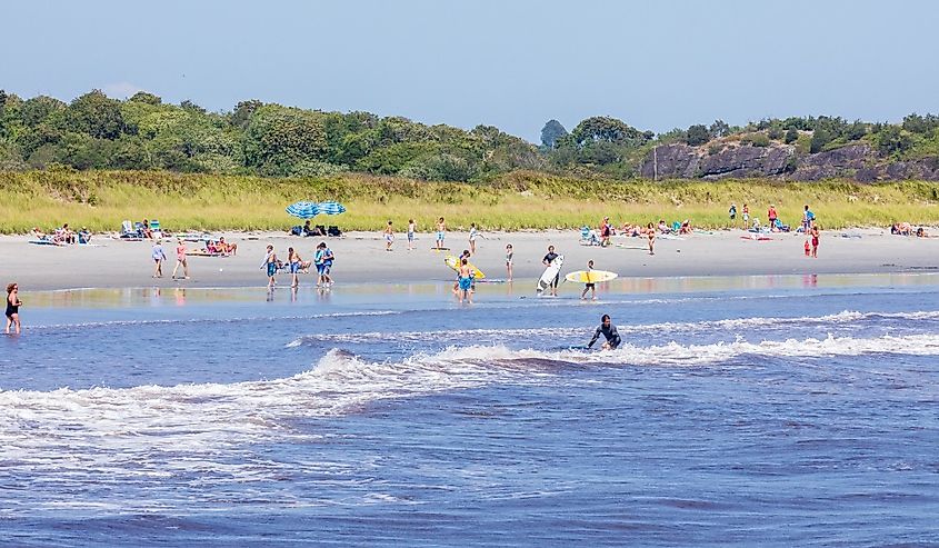 People in the water and surfing at Sachuest Beach, Middletown Rhode Island