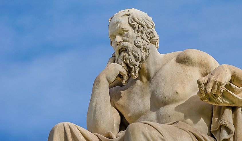 Close-up of a greatest philosopher of Greece Socrates reflects on the meaning of life on the background of blue sky.