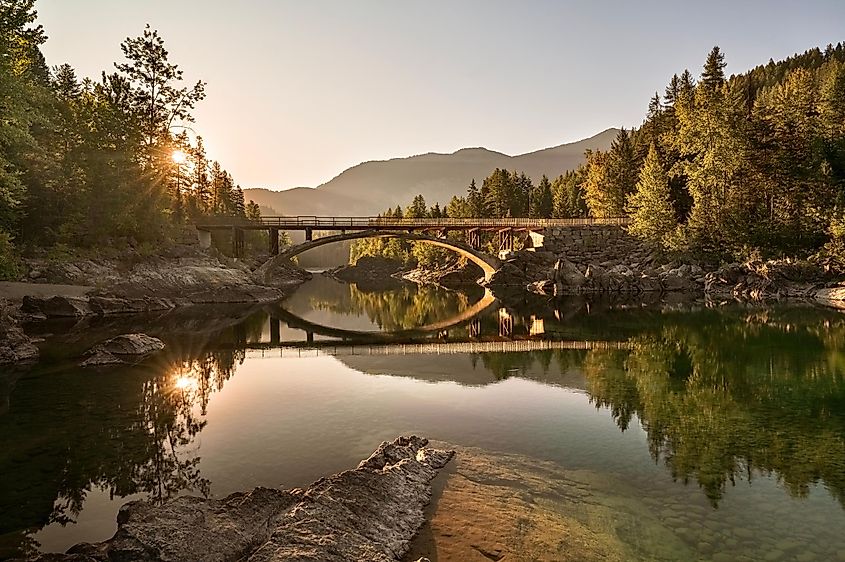 A sunrise across Belton Bridge over Middle Fork Flathead River near West Glacier in Glacier National Park, Montana, USA