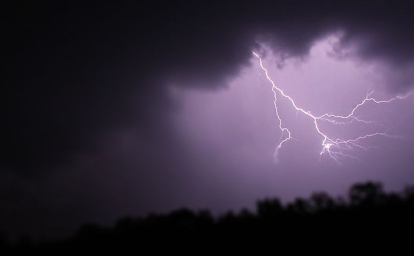 A lightning bolt against a dark sky, illustrating the three main forms of natural lightning: intra-cloud, cloud to cloud, and cloud to ground.