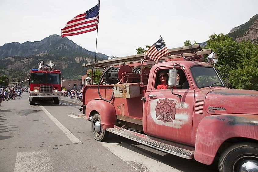 Antique Ridgway firetruck drives drives in July 4 2013 Independence Day Parade, Ouray, Colorado.