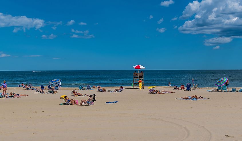 People enjoy a beautiful beach day in Spring Lake New Jersey.