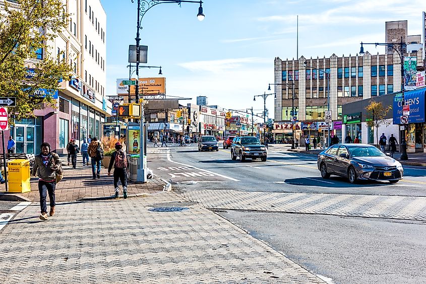 People crossing street in Fordham Heights center, Bronx, New York City.