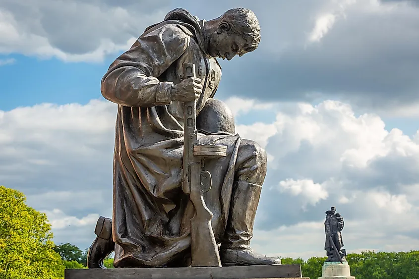 Statue of Red Army soldier paying respect in Tretptower Soviet War Memorial, Berlin, Germany. 