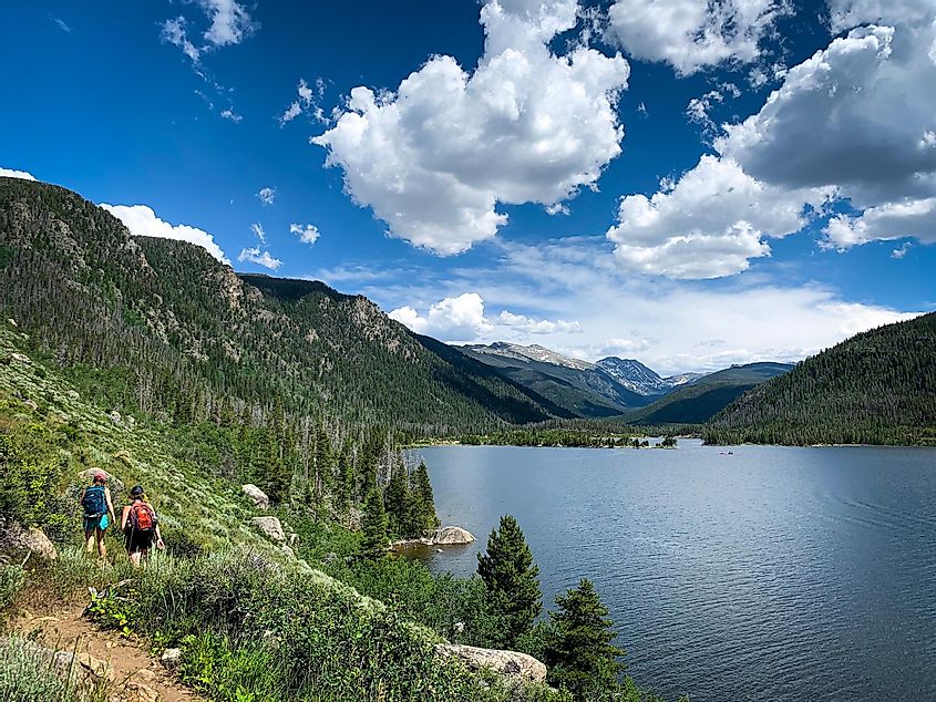  hikers on the trail alongside Lake Granby in Granby, Colorado.