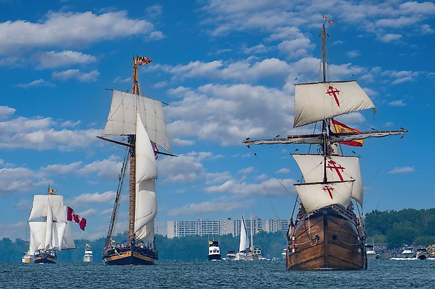 Three Tall Ships sail into Cleveland on Lake Erie during the annual Tall Ships Festival. 