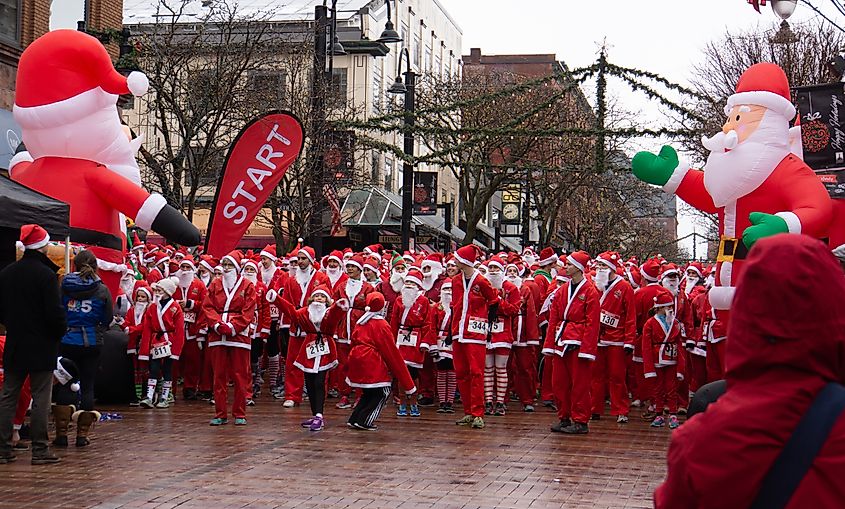Runners dressed as Santa Claus running 5 km for charity in Burlington, Vermont