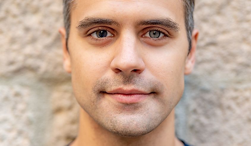 Close up portrait of latin man with heterochromia