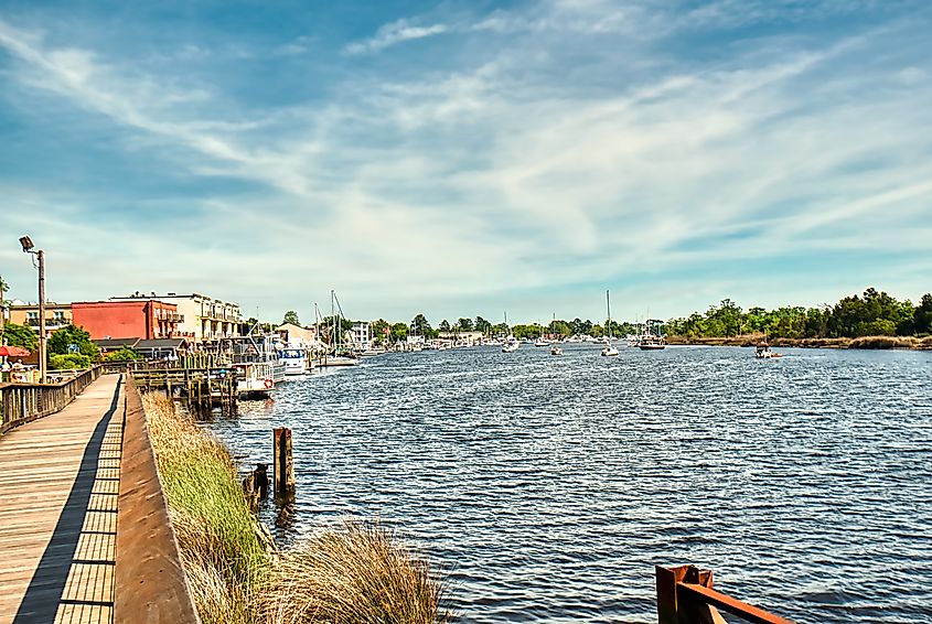 The boardwalk along the river in Georgetown, SC with the marina in the background.