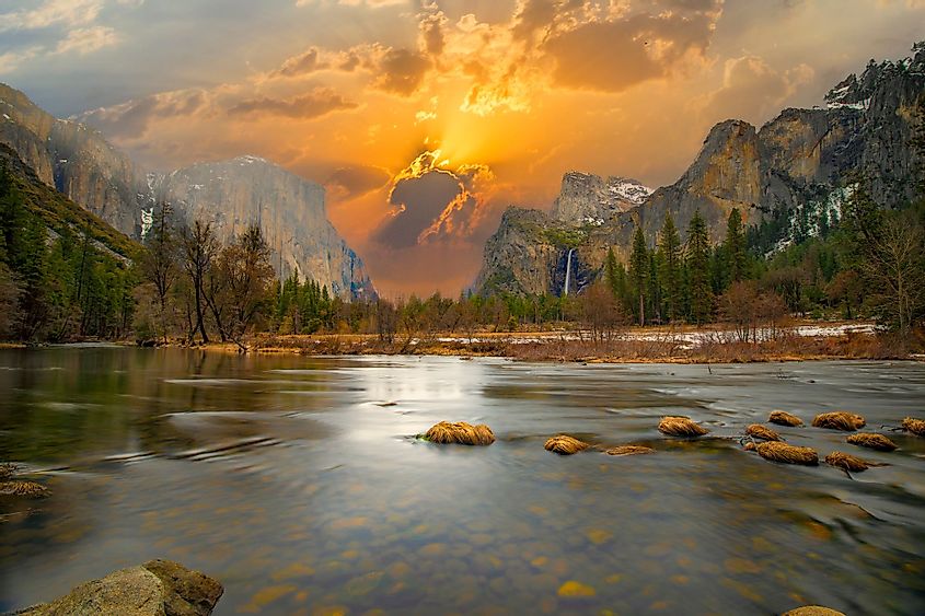 A beautiful view of the Merced River in Yosemite Valley with Half Dome and El Capitan in winter