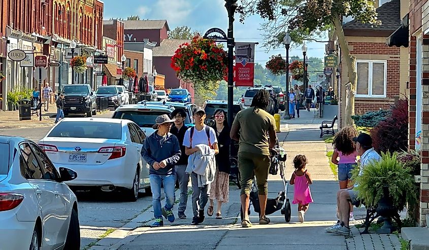 People walking down the street of Port Perry.