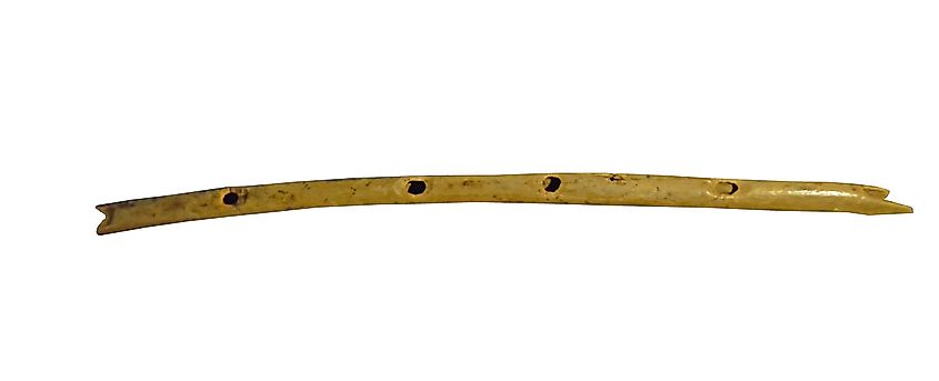 Ice Age flute carved from a vulture's wing bone, dated to about 35,000 years ago with carefully made finger holes.