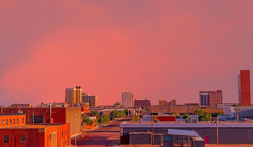 Looking down at the downtown district with a brilliant sunset creating color everywhere in Lubbock, Texas.